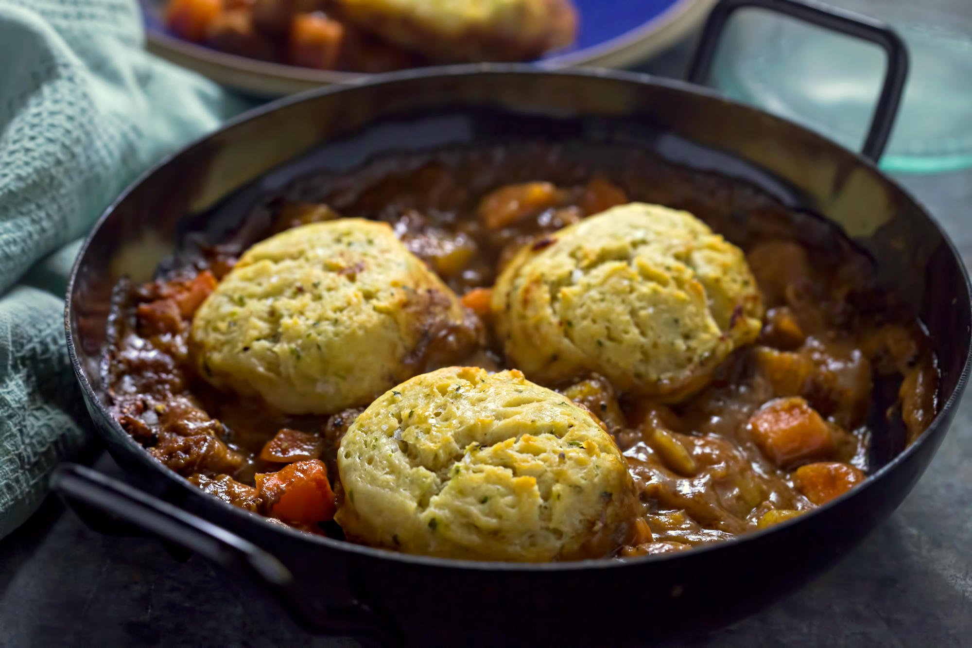 homepage hero banner showing dumplings and beef stew in a serving dish